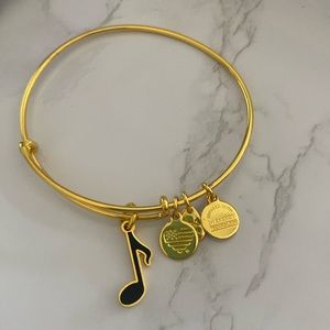 Alex and Ani gold bracelet with black music note